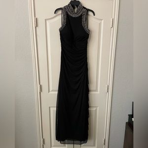 B&A full-length, sleeveless dress with beading and side ruching. Size 12